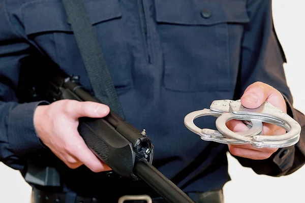 Police officer. With weapons in service. Performs official duties. The inscription in Russian police. — Stock Photo, Image