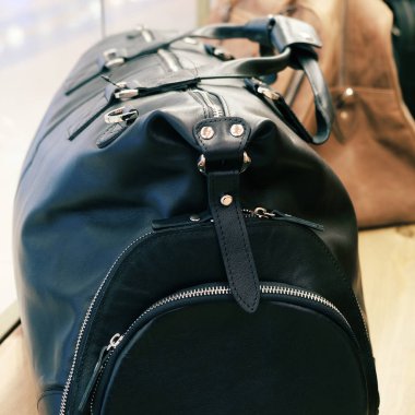 Road leather bag. Luxury travel. Casual style, beauty accessories. Beauty model. Retro style.