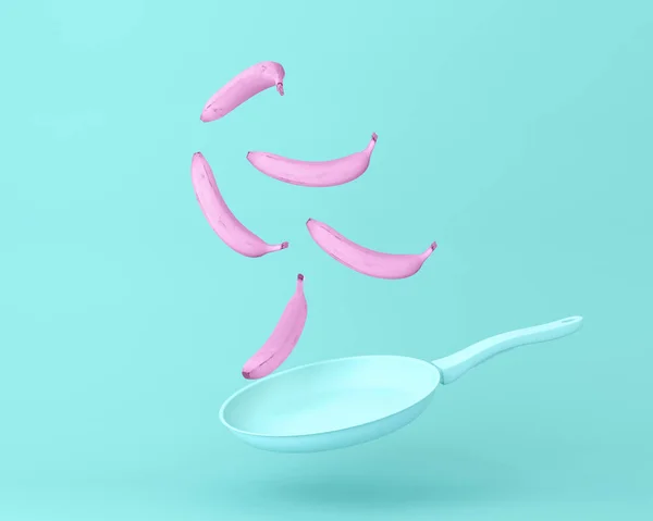 Bananrosa Flyter Med Pan Pastellblå Bakgrund Minimal Konceptfrukt Och Mat — Stockfoto