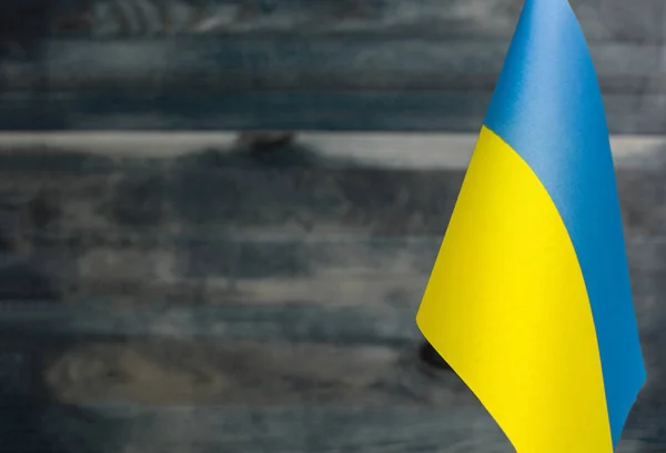 Fragmento Bandera Ucrania Primer Plano Borroso Fondo Madera Lugar Debajo —  Fotos de Stock