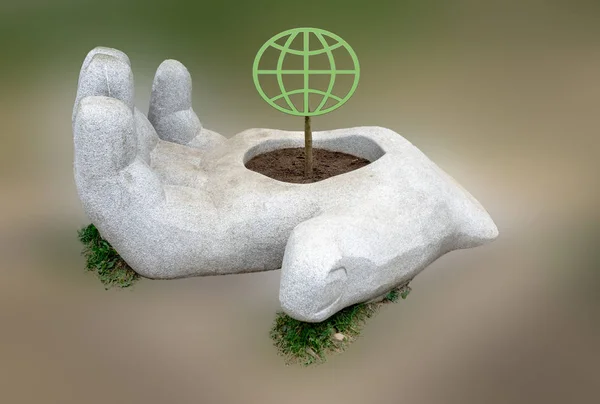Bulanık bir arka planda, bir insanın büyük bir taş gövdesi, üzerinde toprağın yeşil sembolü olan ince bir gövdeyi tutar. Doğayı ve çevreyi koruma kavramı, dünyanın kırılganlığı..