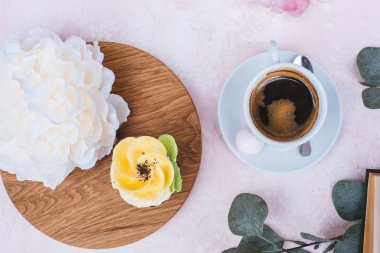 wedding cupcakes on a pink background a cup of coffee 