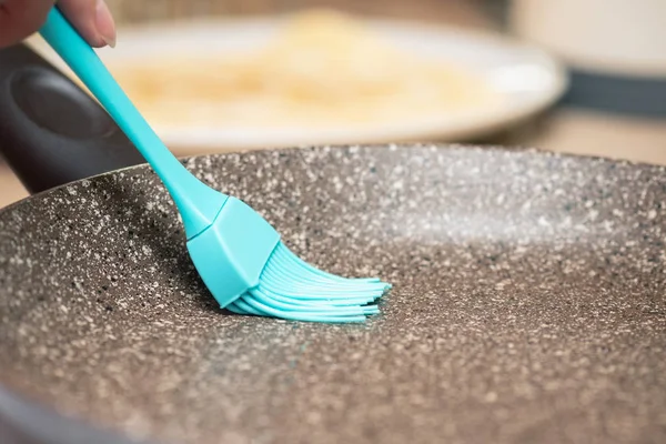 Woman Lubricates Frying Pan Surface Sunflower Oil Kitchen Brush Close — Stock Photo, Image