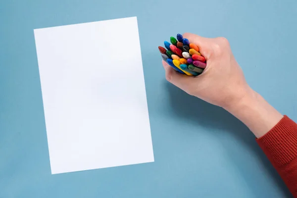 Colorful Pencils Hand Blank Paper Page Copy Space Blue Background Stock Photo