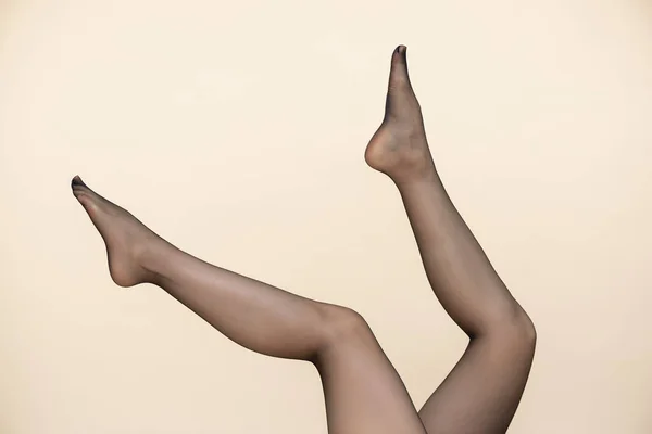 Raised Female Legs Stockings Isolated Light Background — Stock Photo, Image