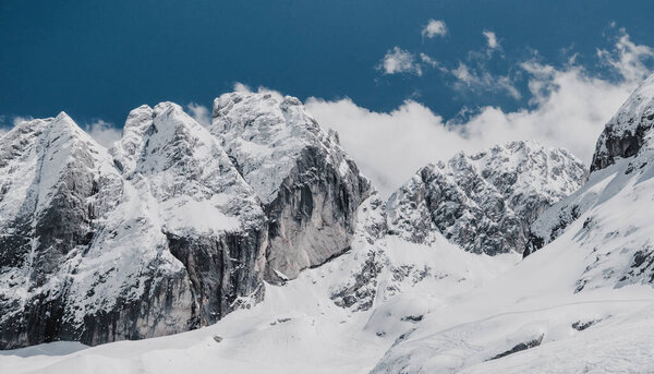  Italian Dolomites snowy mountains and sky.