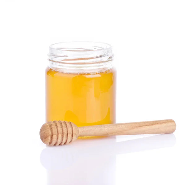 Honey in glass jar Stock Picture