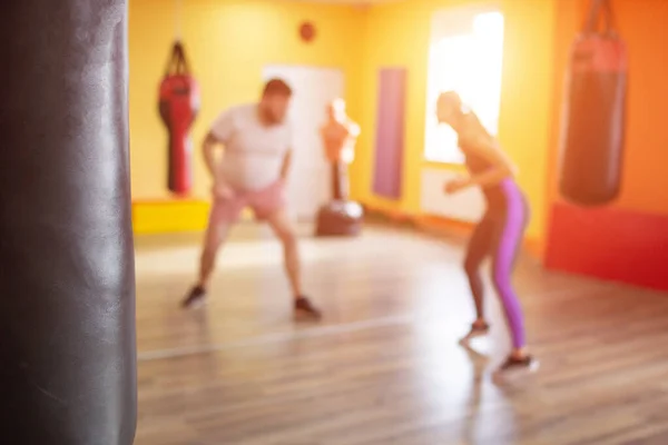 Boxing sparring in training for men and girls under the supervision of a martial arts coach, slow motion, willpower, caucasian, blurred — Stock Photo, Image