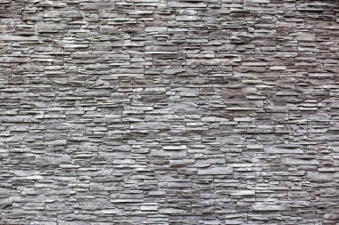 Beautiful wall decoration of gray modern stones bricks, background clipart