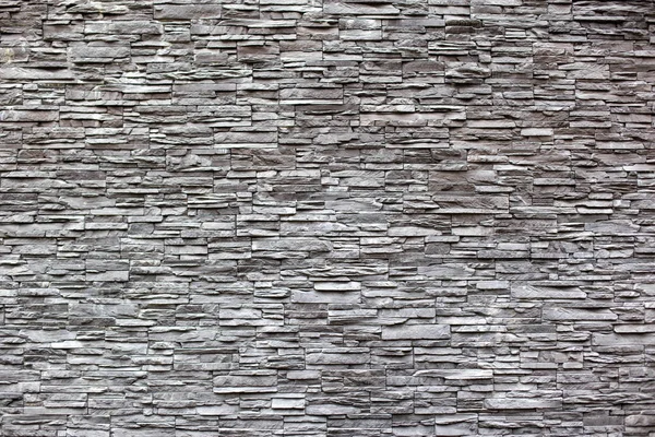 Beautiful wall decoration of gray modern stones bricks, background