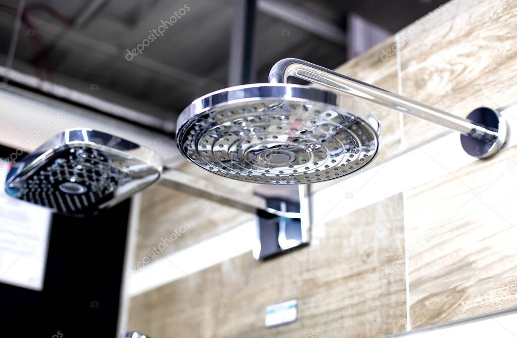 Selling stylish and modern head showers with a water nozzle. Sale of new plumbing, close-up, background, industry