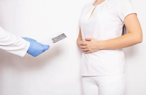 The doctor looks at the results of a study of gastric esophagogastroduodenoscopy for ulcers and cancerous tumors, background — 스톡 사진