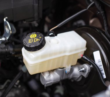 The tank with brake fluid in the car in the engine compartment. The concept of the working brake system, safety