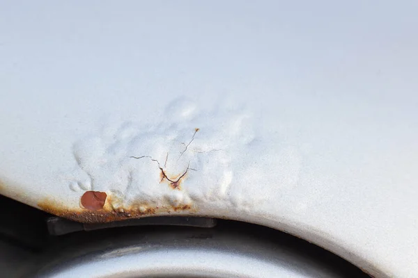 Corrosion and rust on the hood of a car. The concept of anti-corrosion treatment of the car body, macro — Stock Photo, Image