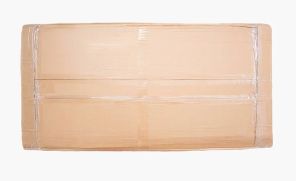 Caixa de papelão em que nova mobília é embalada em um fundo branco, isolar — Fotografia de Stock