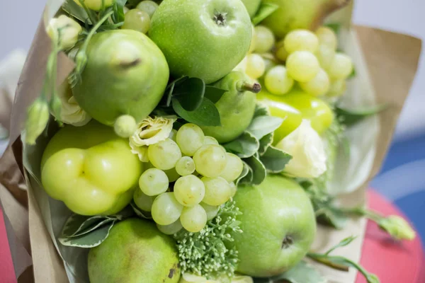 Green fruit bouquet. Apple, pear, grapes, pepper