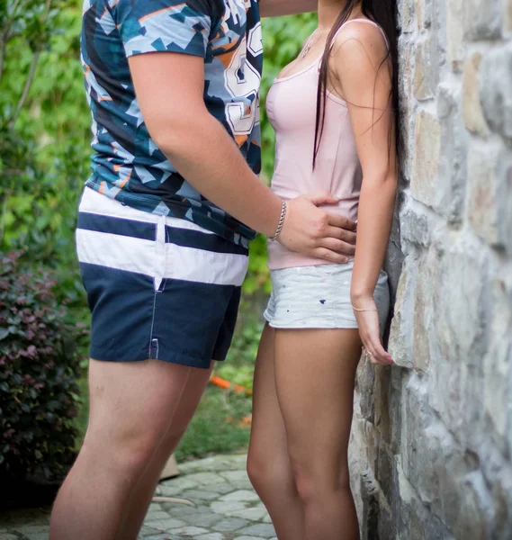 Young couple strolling in summer in the park