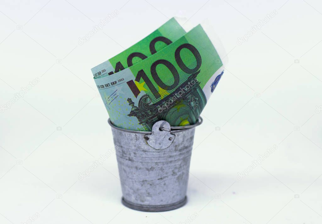 Euro in a bin isolated on white