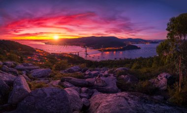 Sunset over the estuary of Vigo from a famous viewpoint and the bank: Galicia is different clipart