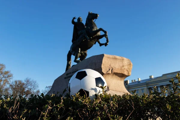 Concept for the World Cup in St. Petersburg. A soccer ball against the background of a brass rider. Monument to the founder of St. Petersburg, Emperor Peter the First