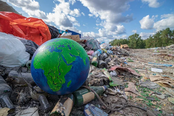 Landscape planet earth in landfill. Concept of environment pollution by garbage.