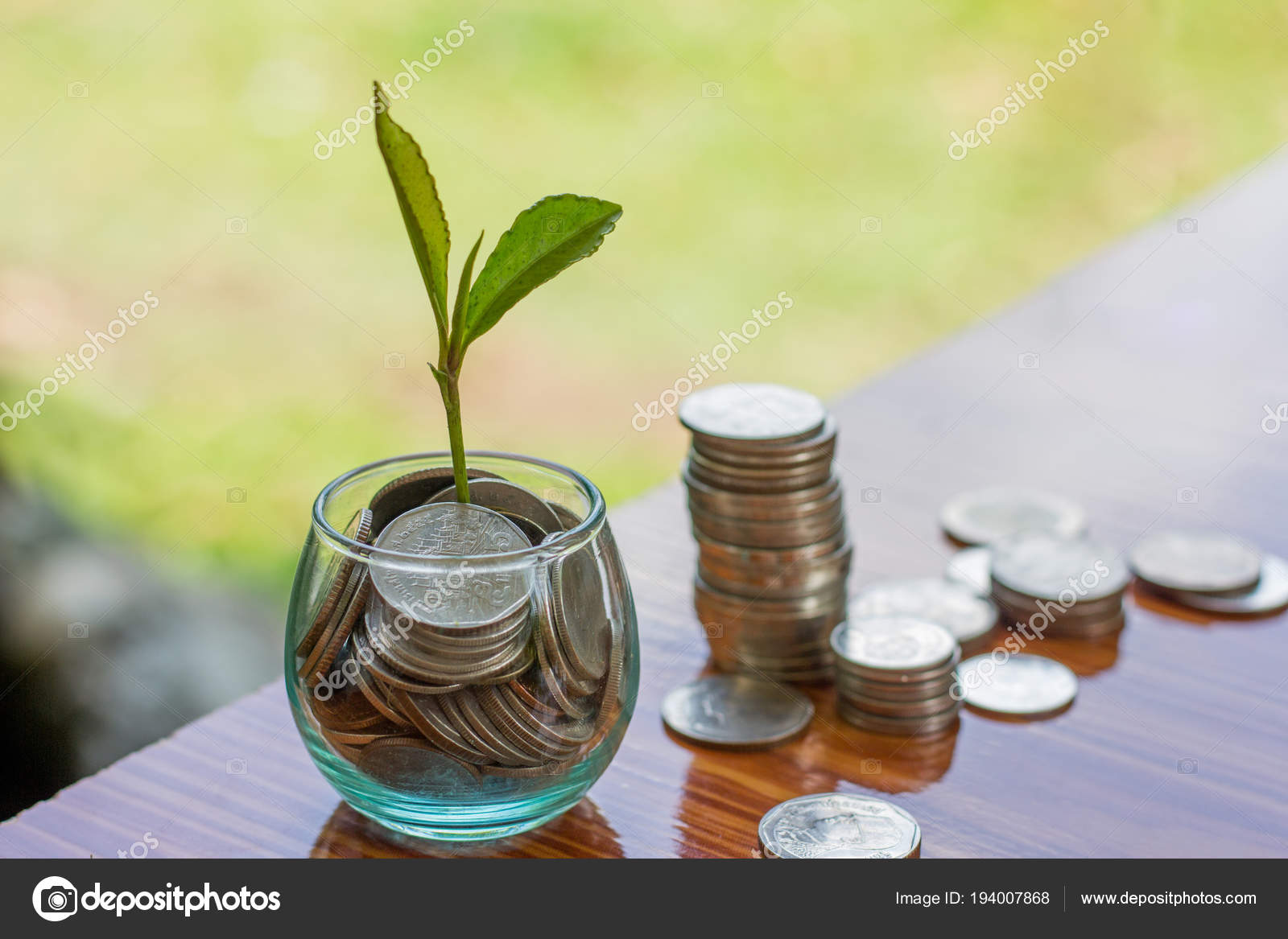 Coin In Glass Bottle With Money Stack Step Up Growing Growth Saving Money Concept Financial Business Investment The Background Is Natural Green Stock Photo Image By C Tinnakorn