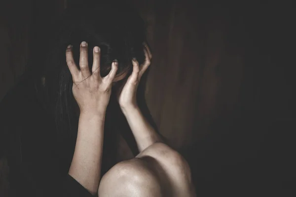 A woman hiding face. Violence against women concept. Depressed t — Stock Photo, Image