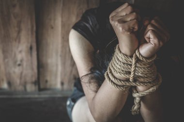  victim woman tied up with rope in emotional stress, rape and se