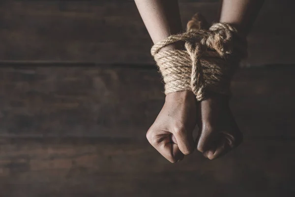 Victim boy with hands tied up with rope in emotional stress and — Stock Photo, Image