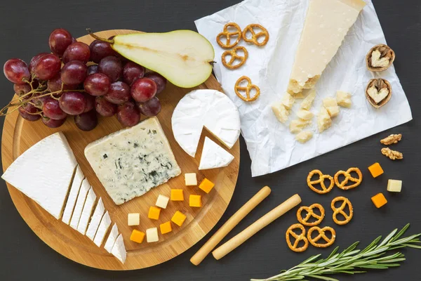 Tasting Cheese Pretzels Fruits Walnuts Bread Sticks Dark Background Food — Stock Photo, Image