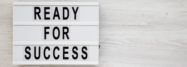 Top view, 'Ready for success' words on a lightbox on a white woo — Stock Photo, Image