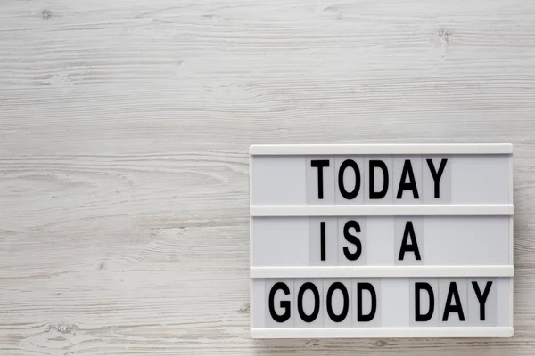 \'Today is a good day\' words on a modern board on a white wooden