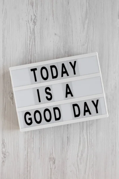 \'Today is a good day\' words on a modern board on a white wooden