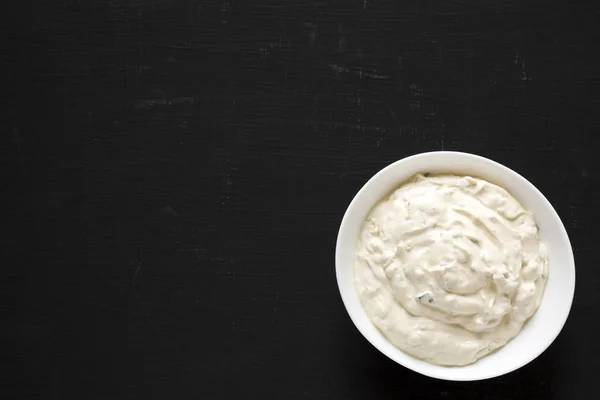 Homemade Caramelized Onion Dip on a black background, top view. — Stock Photo, Image