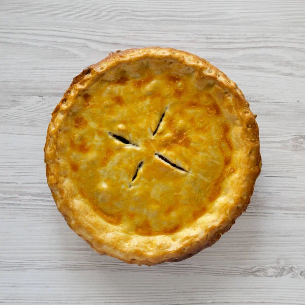 Homemade Canadian Tourtiere Meat Pie on a white wooden table, to — 스톡 사진