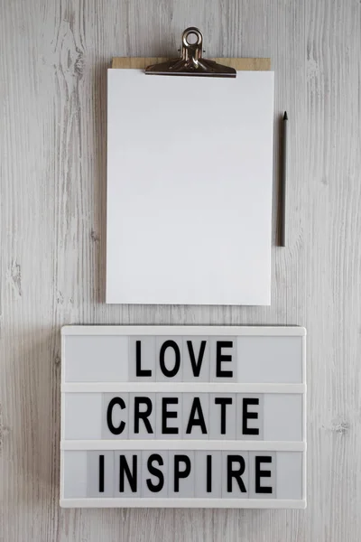 'Love create inspire' words on a modern board, clipboard with bl — 스톡 사진