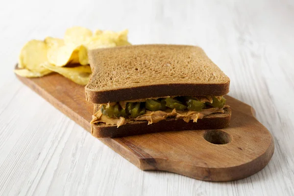 Homemade Peanut Butter Pickle Sandwich Potato Chips Rustic Wooden Board — Stock Photo, Image