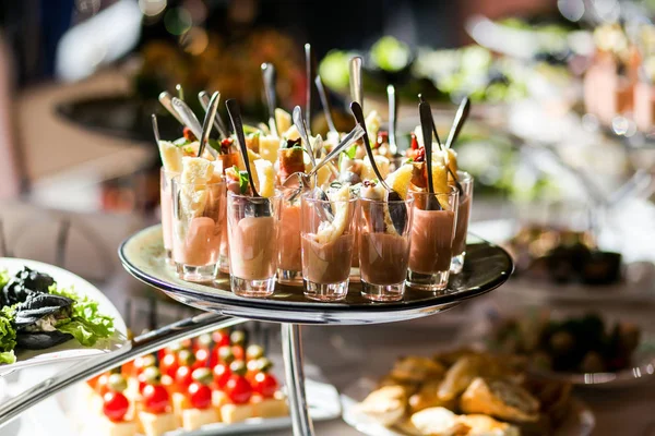 Holiday buffet table served by different canape, sandwiches, snacks ready for eating in restaurant — Stock Photo, Image