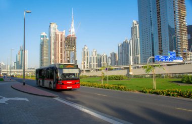 Dubai RTA Bus Passed Through Sheikh Zayed Road newr burj khalifa , Transportation concept clipart
