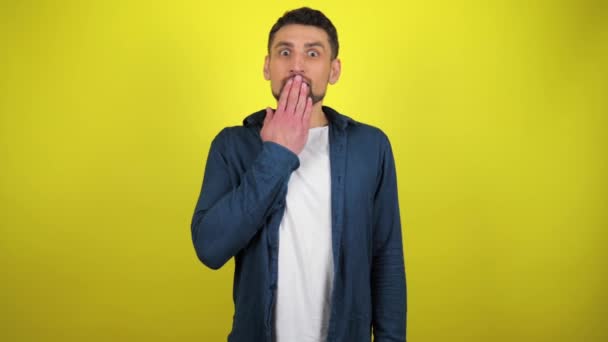 Young Man Blue Shirt White Shirt Looking Camera Covers His — Stock Video