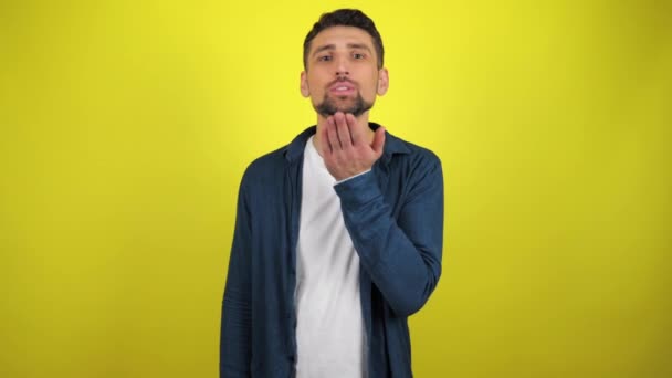 Young Man Blue Shirt White Shirt Looks Camera Guy Blows — Stock Video