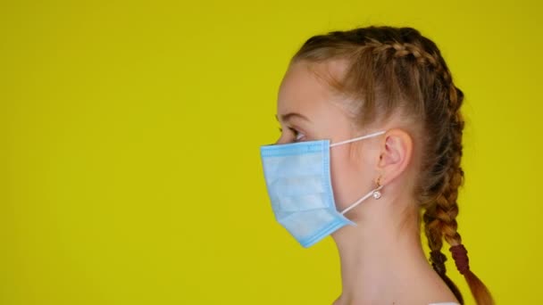 Teen Girl Medical Mask Turns Her Head Camera Epidemic Precautions — 图库视频影像