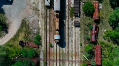 Aerial top view of dump of abandoned rusty trains in city Pripyat near Chernobyl