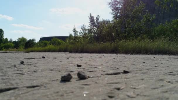 Close-up of broken road amid cooling tower for nuclear reactors of Chernobyl NPP — 비디오