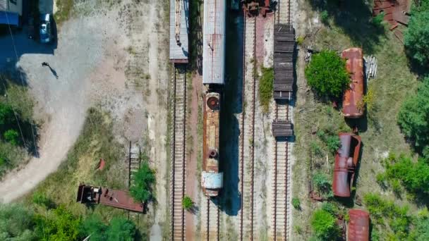 Aerial top view of dump of abandoned rusty trains in city Pripyat near Chernobyl — Stock Video