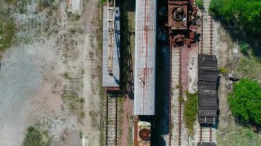 Aerial top view of dump of abandoned rusty trains in city Pripyat near Chernobyl