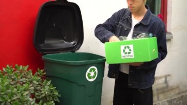 Used plastic  bottles recycle bin. Recycling symbol Solid Waste Management. Recyclable materials paper plastic glass metal