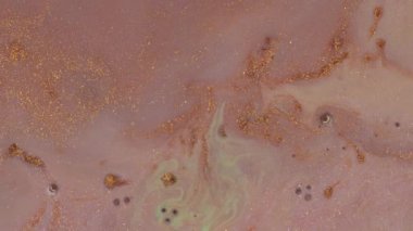 Bronz, sarı ve pembe karışımı. Soyut Boyama Hareketi. Sıvıların Makro Hareketi. Su, akrilik mürekkep ve boya.