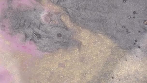 Particules brillantes rose, or et argent. Abstract Glitter Paint Movement. Mouvement macro des fluides. Eau, encre acrylique et peinture 