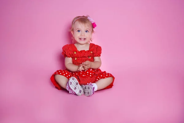 Little Girl Sitting Pink Background — Stock Photo, Image